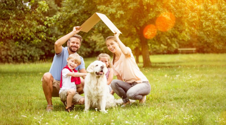 A family with their dog at a park